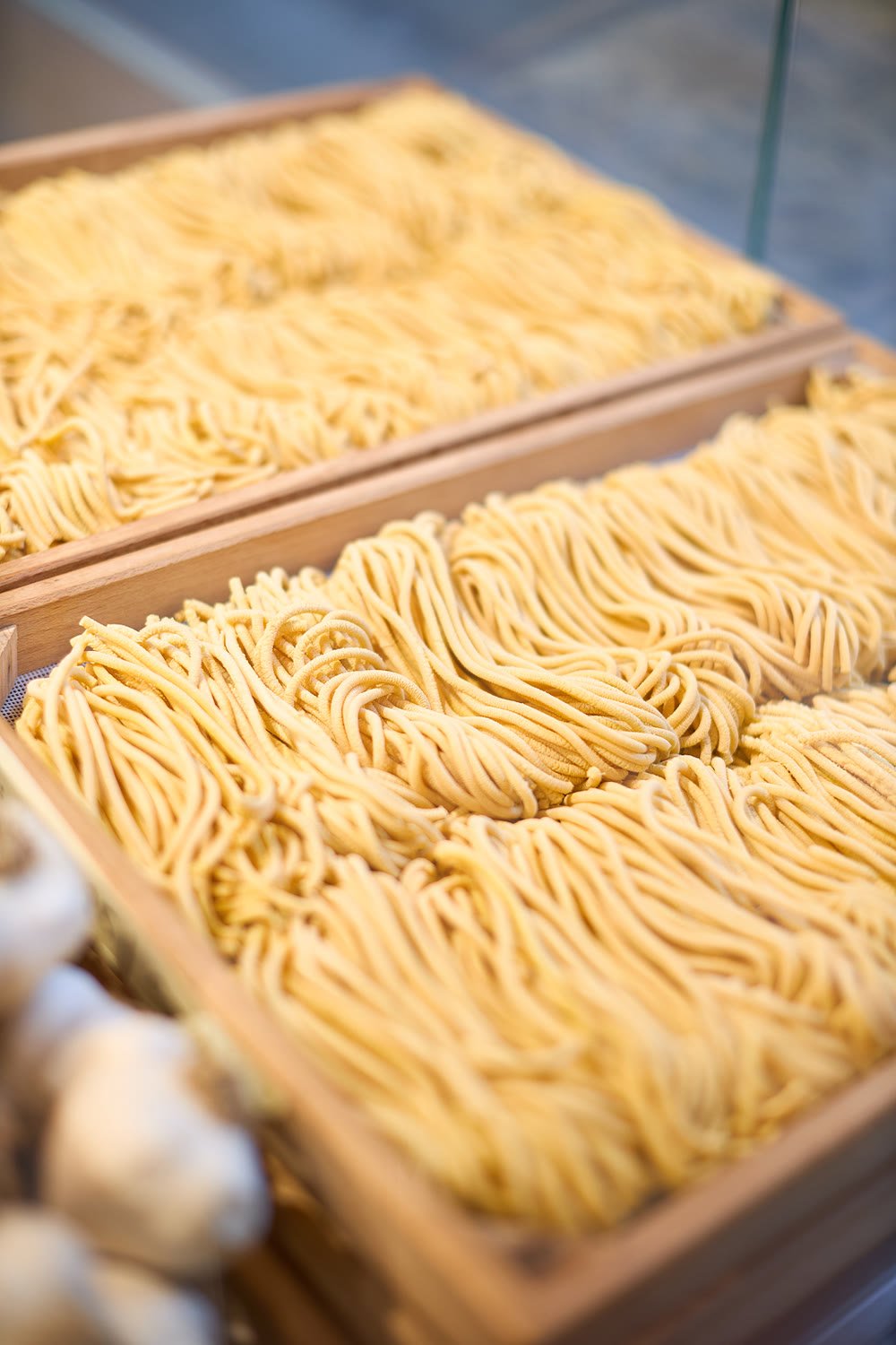 Trays of fresh bigoli behind the counter